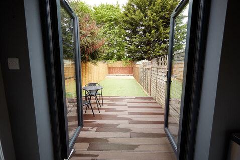 Back door open to a patio looking outside. Anal sex questions? A Plymouth, MN sex and relationship therapist can help. Read on for help in Plymouth, MN 55369 | 55361 | 55391